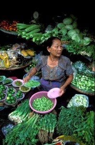 Limes, basil, green onions and fresh coriander sold in Thai fresh market. 